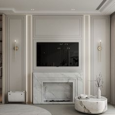 an elegant living room with marble fireplace and built in bookshelves