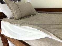 a bed with two pillows on top of it