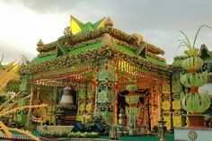 an elaborately decorated green and gold shrine