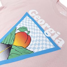 5 oz./yd², pre-shrunk 100% cotton Peach solid color shirt with Georgia Peach graphics Rib-knit crew collar. Neck and shoulder tape. Screen printed graphic on chest Style Code: ALT5190 Casual Peach T-shirt With Graphic Print, Peach Casual T-shirt With Graphic Print, Peach Cotton Graphic Print T-shirt, Spring Peach T-shirt With Graphic Print, Peach Graphic Print T-shirt For Spring, Spring Peach Graphic Print T-shirt, Peach Crew Neck Top With Graphic Print, Heather Peach Graphic Print Crew Neck T-shirt, Peach Solid Color