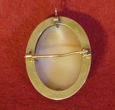 "A Victorian 1890's Roman Maiden 10 Karat Gold Framed Shell Cameo Brooch Pin Pendant. Visit this shop for a wide variety of Vintage Quality Jewelry, Art, and Collectibles. ~Age (approximate): 1890's ~Material(s): Shell/10 Karat Gold Frame ~Approx. Size: 1 1/2\" across x 1 1/4\" high ~Approx. Weight: 4.0 DWT ~Signature / Brand: Unsigned ~Condition: Very Good. Slightly Bent Pin. ~International Shipping: Is Available, please contact us for a quote. ~Inventory #: 6575" Victorian Style Formal Brooches, Antique Cabochon Brooch For Formal Occasions, Antique Cabochon Brooch For Formal Wear, Victorian Cabochon Brooch For Collectible, Victorian Oval Hallmarked Brooches, Classic Oval Cameo Brooch, Collectible Oval Cameo Brooch, Antique Oval Cameo Brooch, Oval Silver Cameo Brooch