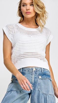 This open weave knit vest top is a versatile addition to your wardrobe. With cap sleeves and a loose fit band, it can be worn as both a top or a vest. The delicate knit adds a touch of elegance to any outfit. Make a statement with this piece. 100% cotton small length 19 1/2", bust 21 1/2" Knit Vest Top, White Knit Top, The Comeback, Weekend Activities, Latest Trend, Open Weave, Jumpsuit Shorts Rompers, Pullover Designs, Working Hard