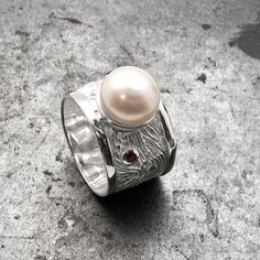 Cultured White Pearl Wide Band Sterling Silver Ring, Pearl Wedding, Pearl Anniversary, Lucky Birthstone Gift Ring  925 Sterling silver ring bandwidth: 15 mm South Sea cultured white pearl: 11 mm Selection of natural red ruby or natural blue sapphire 3 mm Hallmarked 925 onto the inside of the ring Here you may find more Handmade Greek Fine Jewelry: http://www.sunsan.etsy.com ⭕Please kindly, before placing your order read carefully to understand the: - Item description - Item's materials/measureme White Hallmarked Pearl Ring For Anniversary, White Hallmarked Pearl Anniversary Ring, Fine Jewelry White Pearl Birthstone Ring, White Pearl Birthstone Ring Fine Jewelry, White Pearl Birthstone Ring In Fine Jewelry, White Pearl Ring For Anniversary, Pearl Gemstone Rings For Anniversary, White Sterling Silver Pearl Ring For Anniversary, White Pearl Drop Ring For Anniversary