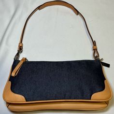 Rare Adorable Y2k Vintage Denim Coach Baguette With Light Tan Leather Accents. Stunning Craftsmanship And Made With Fine High-Quality Materials. The Bag Is In Like New Perfect Condition. Maybe Worn Once. No Staining On The Inside Or Outside, No Signs Of Wear. Ready To Be Someone’s Favorite Little Bag This Spring And Summertime. All Sales Are Final Reasonable Offers Will Be Accepted Free Shipping With Bundles Message Me If You Have Any Questions Coach Denim, Leather Accents, Mini Shoulder Bag, Light Tan, Vintage Coach, Denim Mini, New Vintage, Vintage Denim, Y2k Vintage