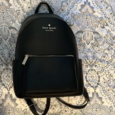 Nwot Kate Spade Black Leila Large Flap Leather Backpack. Never Worn After Taking It Out Of The Package. 13.3”H X 9.4”W X 7.6”D Pebbles Leather, Metal Pinpoint, 2 Way Spade Jacquard, Front Zip, Side Slip Pockets, And Zip Around Kate Spade Backpack With Removable Pouch, Kate Spade Travel Backpack, Elegant Kate Spade Backpack With Zipper Closure, Kate Spade Black Backpack With Removable Pouch, Classic Kate Spade Backpack With Removable Pouch, Kate Spade Black Backpack With Detachable Strap, Kate Spade Standard Backpack For Travel, Kate Spade Black Backpack For On-the-go, Kate Spade Black Everyday Backpack