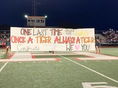 a banner with the words one last time, once a tiger aurrator we love you on it