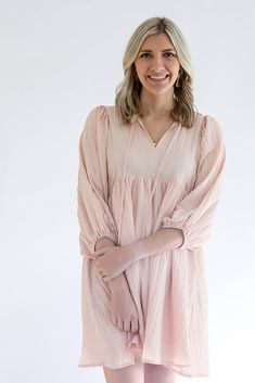 The You Make Me Blush blush pink mini dress has us swooning! This mini dress is the perfect shade of pink and detailed with 3/4" sleeves, a self front tie, and beautiful textured fabric. This dress is fully lines and has pockets. We think this is the perfect Springtime dress and can even be worn into summer. This would be adorable for a girls night outfit, or a wedding guest dress. - Textured v- neck - 3/4 sleeves - Self tie at front neck - Pockets - Lined - Non-sheer and lightweight - True to S Feminine Blush Mini Dress For Brunch, Feminine Blush Mini Dress For Spring, Pink 3/4 Sleeve Dress For Brunch, Make Me Blush, Girls Night Outfit, Pink Mini Dress, Favorite Daughter, Guest Dress, Pink Mini