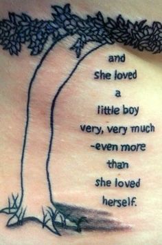 a woman's stomach with a tree and quote on the back of her ribs