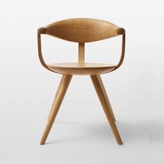 a wooden chair with a curved seat and legs