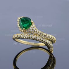 This ring is made with Pear Zambian Emerald Genuine Gemstone Ring/ Real Cluster Diamond Pave Ring/ 18K Solid Gold Snake Ring/ Serpent Ring/ Wrap Around Ring. * SKU: SPBR00600 * Made to Order. * Gold Purity: 18K Solid Yellow Gold (stamped) * Custom Gold Color: Yellow, Rose, White Gold * Custom Gold Purity: 9K/14K/18K (Charges Apply) * Diamond 100% Genuine Diamond * Diamond Weight: 0.67 ct. * Diamond Color: G-H * Diamond Clarity: SI1- SI2 * Diamond Cut: Brilliant Cut (Excellent) * Emerald Weight: Yellow Gold Crystal Ring With Stone Setting, Green Snake Ring For Gift, Green Snake Ring Gift, Gold Ring With May Birthstone In Fine Jewelry Style, Gold Hallmarked Ring For May Birthstone, Fine Jewelry Gold Ring With May Birthstone, Gold Rings For May Birthstone In Fine Jewelry Style, Luxury Gold Diamond Ring For May Birthstone, Yellow Gold Diamond Promise Ring With Stone Setting