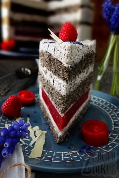 a piece of cake with red, white and blue frosting on it sitting on a plate