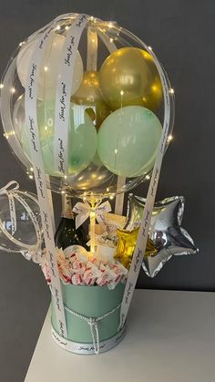 a basket filled with balloons and confetti