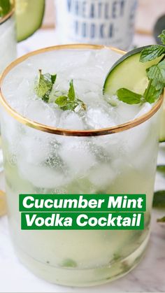 a cucumber and mint mojita cocktail in a tall glass with ice