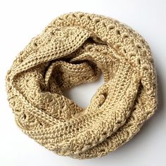 the knitted scarf is on display with text overlay