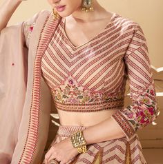 COLOR : Desert Sand FABRIC : Top (Blouse) - Premium Silk, Bottom (Lehenga) - Premium Silk, Inner - Cancan, Dupatta - Organza WORK : Silk Thread Embroidery, Sequins, Digital Print, Floral Motifs, Lace Border OCCASION : Wedding, Reception, Sangeet, Engagement READY-TO-WEAR : NoSTITCHING : Available as semi-stitched fabric, can be stitched using standard size option (+$30). Note: There might be a slight color variation due to lighting and flash used during photoshoot. The bright shade seen is the b Long-sleeved Lehenga For Navratri With Floral Embroidery, Long Sleeve Lehenga With Floral Embroidery For Navratri, Floral Embroidered Long Sleeve Lehenga For Navratri, Fitted Saree Dress For Ceremony, Fitted Anarkali Sets With Intricate Embroidery, Fitted Dress With Resham Embroidery For Ceremony, Fitted Wedding Blouse Piece With Floral Embroidery, Fitted Floral Embroidery Blouse Piece For Wedding, Fitted Lehenga With Zari Work For Ceremony