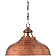 a large copper colored light hanging from a chain