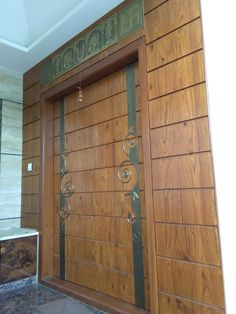 a large wooden door with decorative designs on it