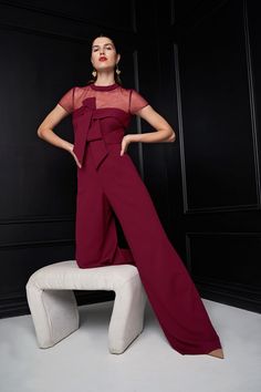 Elegant yet comfortable, our jumpsuit is crafted with stretch knit crepe—showcasing a beautiful drape. Framed by an illusion neckline, it features a stunning oversize bow detail. Final touches include a back zipper and a wide leg silhouette at the hem. India And Pakistan, Jumpsuits And Romper, Beautiful Drapes, Jumpsuit Fashion