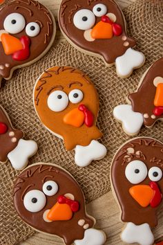 decorated cookies in the shape of turkeys on a table