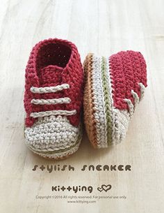 a pair of crocheted baby shoes sitting on top of a wooden floor with the words english sneaker written below it