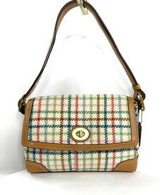 Coach Hampton F13984 Multicolor Plaid Wool Shoulder Bag Purse Brass Turn Lock Are you looking for a purse that not everyone has? This lovely Coach Hampton F13984 multicolor (summer colors such as sky blue, pastel pink, rose red, almost navy blue and seafoam green on a cream background) plaid wool medium shoulder bag has a front flap with brass hardware including a front turn lock. So fun and unique. The brown leather strap with brass buckles on each end has never been adjusted so it's totally re Plaid Purse, Pretty Accessories, Western Purses, Long Slip, Blue Pastel, Cream Background, Brown Leather Strap, Brass Buckle, Winter 2023