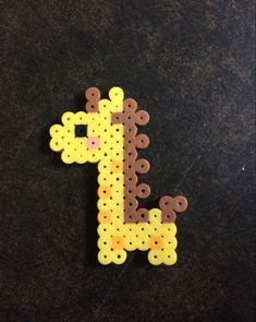 a giraffe made out of plastic beads