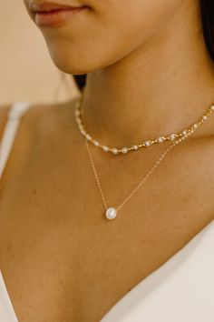 Cassie Layered Necklace Set – Wander + Lust Jewelry White Pearl Chain Jewelry For Everyday Elegance, Double Strand Pearl Necklace For Layering, Everyday Elegance Pearl Chain Jewelry, Elegant Pearl Necklace For Everyday Wear, Elegant Pearl Necklace For Everyday Elegance, Dainty Double Strand Necklace With Pearl Charm, Everyday Elegance Pearl Pendant Jewelry, Everyday Elegant Pearl Pendant Jewelry, Feminine Gold Jewelry With Pearl Charm