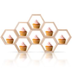 cupcakes with frosting arranged in hexagonal honeycombs on white background