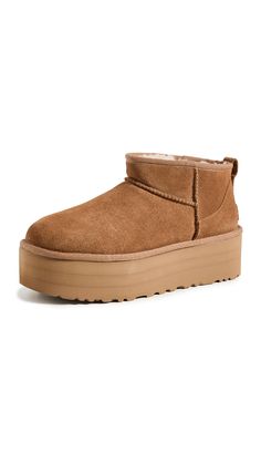 PRICES MAY VARY. Suede upper 17mm UGGplush wool lining 17mm UGGplush wool insole SugarSole EVA outsole 2" platform height Cute Uggs, Ugg Store, Preppy Shoes, Ugg Classic Ultra Mini, Shoe Wishlist, Preppy Fall, Trendy Fall Outfits, Shoe Inspo, Fall Fits