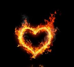 a heart shaped fire on a black background