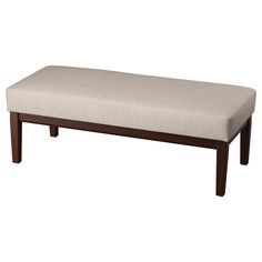 a wooden bench with a beige upholstered seat