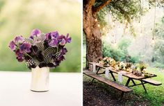 a table with flowers in a vase next to a bench