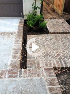 an image of a brick patio being used as a planter in front of a house