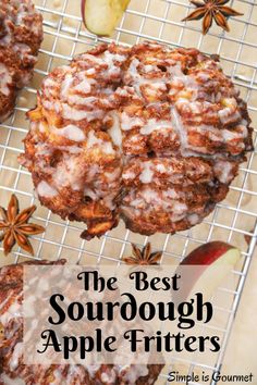 the best sourdough apple fritters on a cooling rack with an apple in the background