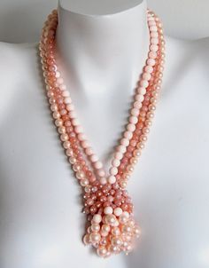 "Haskell inspired multi strand retro design beaded handmade necklace by LIA, featuring three strands of 6mm pink Botswana rounds, 8mm pink pearls and blush pink shell beads with a tasseled pendant as focal. Necklace is 21\" long, including the elegant Bali sterling silver toggle clasp and end cones and has been strung on flexible nylon coated stainless steel stringing wire for strength and durability.  My sterling silver hand stamped maker's mark tag hangs from end of necklace.  Handmade in the USA by Lia Galletti at the LIA Jewelry Designs studio in Fort Myers, FL A distinctive statement of taste any time of day or night which will make you proud to wear or give. Each piece of handmade beaded jewelry is unique and one-of-a-kind. All my jewelry will arrive wrapped in tissue, inside a cotto Pink Botswana Agate, Necklaces Etsy, Stamp Maker, Jewelry Design Studio, Pink Pearls, Botswana Agate, Handmade Beaded Jewelry, Multi Strand Necklace, Shell Beads