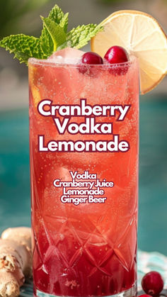 cranberry vodka lemonade is garnished with fresh cherries