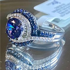 Blue And White Cubic Zirconium Rhodium Over Sterling Silver Ring!! Size 9. Bella Luce Esoterica White Diamond Simulates 3.95 Ctw Over Sterling Silver! Measures Approximately 0.88” L X 0.55” W And Is Not Sizable! Weighs 3.99 Grams. Band Width Is 0.06 Inches! Nwt. Three Day Money Back Guarantee! All Jewelry Is Cleaned And Polished Before Shipping! Dazzling Blue Sapphire Ring With Accent Stones, Dazzling Blue Tanzanite Rings, Blue Sapphire Ring With Vs Clarity And Round Cut, Blue Diamond Wedding Band, Paw Print Ring, Rose Gold Ring Set, Sparkly Ring, Raw Stone Ring, Silver Heart Ring