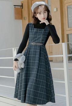 Our signature tweed plaid fabric in a classic pinafore silhouette. Features a square neckline, open sides, buttons, belted waist and midi length skirt. Lined. Concealed side zipper. S: 24.5" waist, 42" lengthM: 26" waist, 42" lengthL: 27.5" waist, 42.5" lengthXL: 29" waist, 42.5" length Fall Plaid Dress With Square Neck, Square Neck Winter Workwear Dress, Winter Workwear Dress With Square Neck, Midi Length Skirts, Pinafore Dress, Plaid Fabric, Overall Dress, Sweater Blouse, Cardigan Jacket