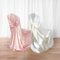 two white and pink chairs sitting next to each other on top of a wooden floor