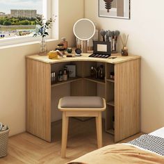 a bedroom with a desk, mirror and stool next to a window overlooking the city