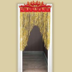 an open door with red and gold decorations hanging from it's front entrance,