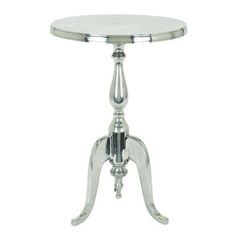 a small round table with metal legs