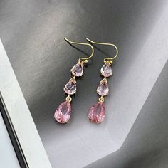 Dainty Pink Crystal Earrings, July Birthstone, Soft Pink Drop Earrings, Wedding Jewelry, Pink Teardrop Earrings, Bridesmaid Gift Earrings. Earrings made from faceted soft pink crystals and gold framed teardrop crystals same color. Matching charm necklace is available for purchase (NOT included with earrings). Measurements: The total length from the top of the hook to bottom - 1.85 inches (47 mm) approximately. Teardrop crystals 14 mm x 8 mm Connector crystals: 6 mm x 8 mm The earrings would be a Cheap Pink Earrings For Festivals, Affordable Pink Crystal Metal Earrings, Affordable Pink Dainty Jewelry, Affordable Pink Casual Earrings, Cheap Casual Pink Earrings, Cheap Pink Party Jewelry, Cheap Resizable Pink Jewelry, Affordable Pink Teardrop Crystal Earrings, Pastel Pink Dress Matching Earrings