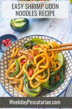 a bowl filled with noodles and vegetables on top of a table next to chopsticks