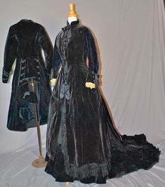 "Antique Bustle Dress 1870s Walking Suit Outfit - 3-Piece Trained - Museum Deaccession This is an attractive reception outfit of the 1870's period, that a mid to upper class woman would wear. A regal 1870's - 1875 deep navy blue and black velvet 3 piece in construction bustled reception outfit recently de-accessioned from the Rochester historical society museum in New York state. The outfit still retains it's original Museum ID catalog identification tag, inside each jacket with donor's name on Antique Victorian Dress Costume With Historical Design, Antique Victorian Costume Dress With Historical Design, Victorian Costume Dress With Buttons, Victorian Style Costume Dress With Buttons, Antique Fitted Victorian Dress With Historical Design, Historical Victorian Wedding Dress With Buttons, Green Velvet Gown, 1870s Dress, Train Museum