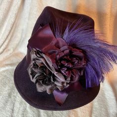 Purple Feathered Fur Felt 40's Style Hat By Fleur De Paris Hat Name: Fifi Style : 1839 This Hat Was Signed By The Milliner. Signature Is On The Inside Band. This Hat Comes Complete With The Original Sales Tag. Hat Was Made In 2019, The Shop Is Still Located In The French Quarters In New Orleans, La. The Original Selling Price On This Hat Was $499 Back In 2019. The Prices Have Gone Up Now. This Millinery Business Is Very Pricey And Their Hats Bring High Prices Because They Are Made As A "One Of A Fitted Purple Wide Brim Top Hat, Purple Fitted Top Hat With Curved Brim, Vintage Purple Hat With Short Brim, Vintage Short Brim Purple Hat, Purple Fitted Top Hat With Short Brim, Vintage Purple Party Hat, Feather Signs, Paris Hat, 40's Style