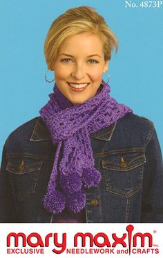 a smiling woman wearing a purple scarf and denim jacket with her hands in her pockets