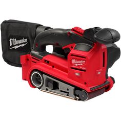 a milwaukee band sander is shown with its case on the side and it's cordless handle