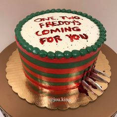 a cake with writing on it sitting on top of a gold plated platter