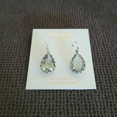 Brand New On Product Card Shivam Green Amethyst Teardropearrings Excellent Condition With No Flaws Approx 1-1/2" Drop 925 Sterling Silver Multifaceted Teardrop Shaped Green Amethyst Gemstone In A Beautiful Silver, Scallop Laced Setting French Hook Backing Made In India Please No Trades Or Lowballs! *Ask Any Questions You May Have Prior To Making An Offer Or Purchase Please* Silver Sterling Silver Pear-shaped Crystal Earrings, Silver Pear-shaped Sterling Silver Crystal Earrings, Pear-shaped Sterling Silver Crystal Earrings, Silver Teardrop Pendant Earrings As Gift, Silver Pear-shaped Jewelry With Ear Wire, Nickel Free Pear-shaped Silver Earrings, Silver Teardrop Crystal Earrings For Anniversary, Silver Teardrop Crown Earrings For Formal Occasions, Silver Teardrop Crown Earrings For Formal Events